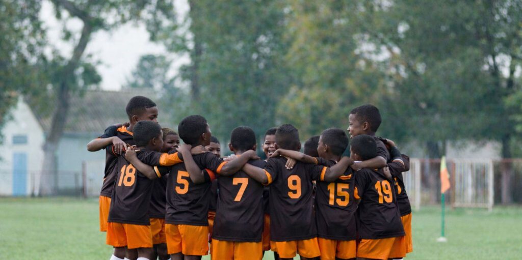 Team of boys in a huddle